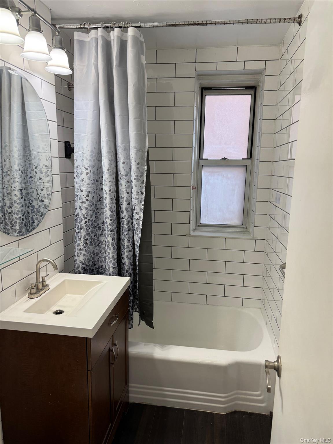 325 East 201st Street, Unit 3J Bronx, NY 10458 - Photo 21 of 33 a bathroom with a sink and a bathtub