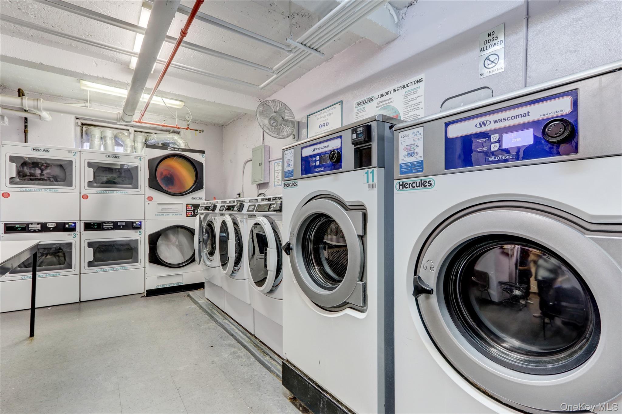325 East 201st Street, Unit 3J Bronx, NY 10458 - Photo 28 of 33 a utility room with dryer and washer