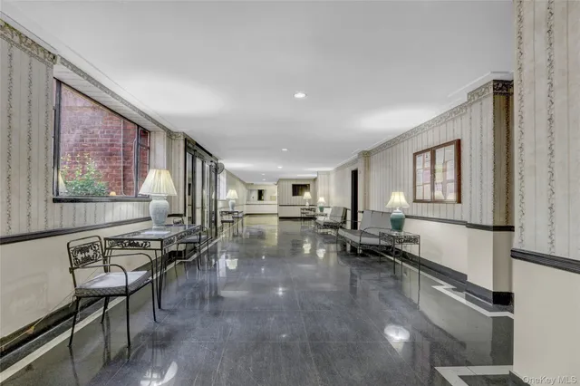 a lobby with furniture and window