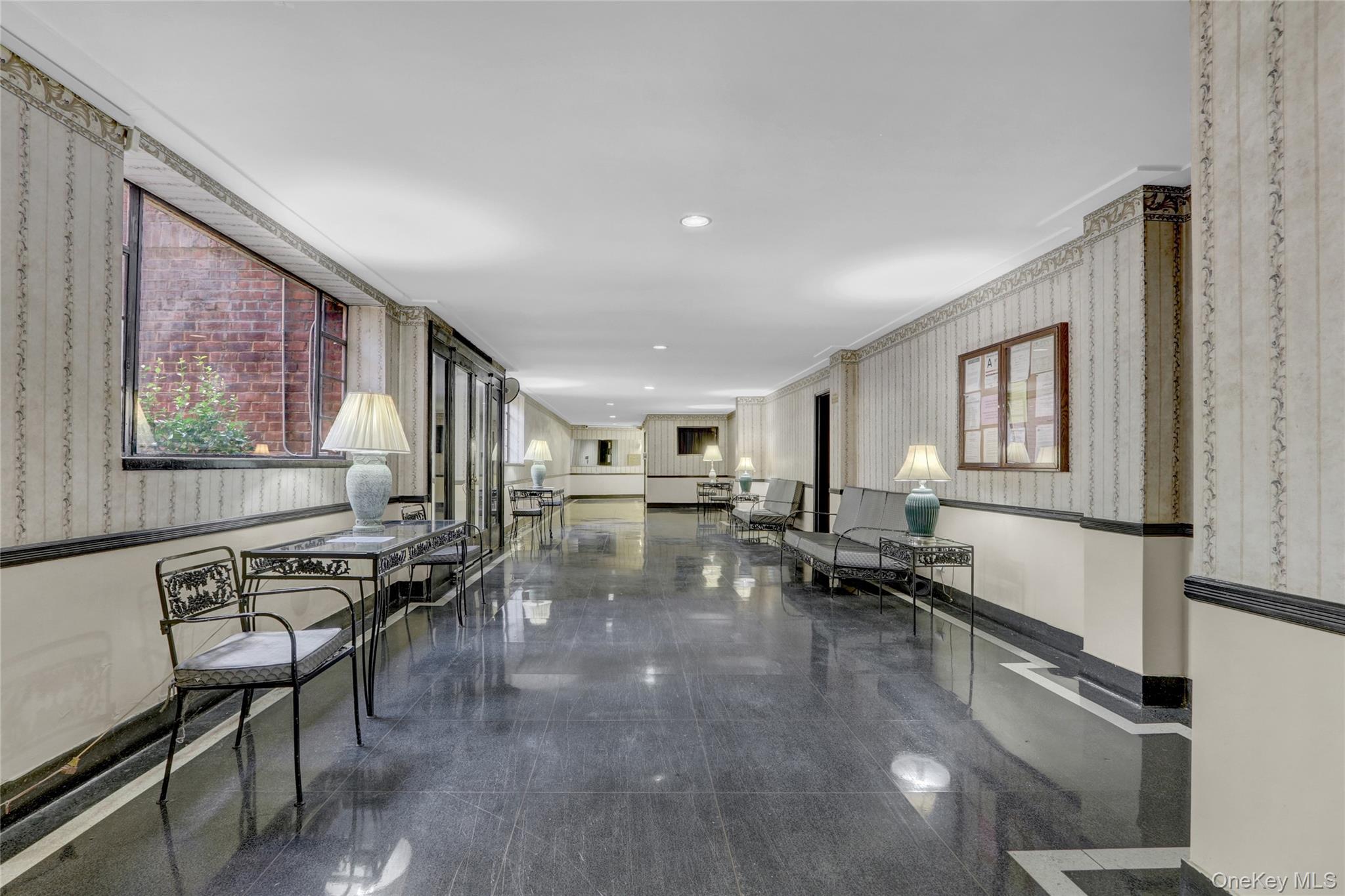 325 East 201st Street, Unit 3J Bronx, NY 10458 - Photo 3 of 33 a lobby with furniture and window