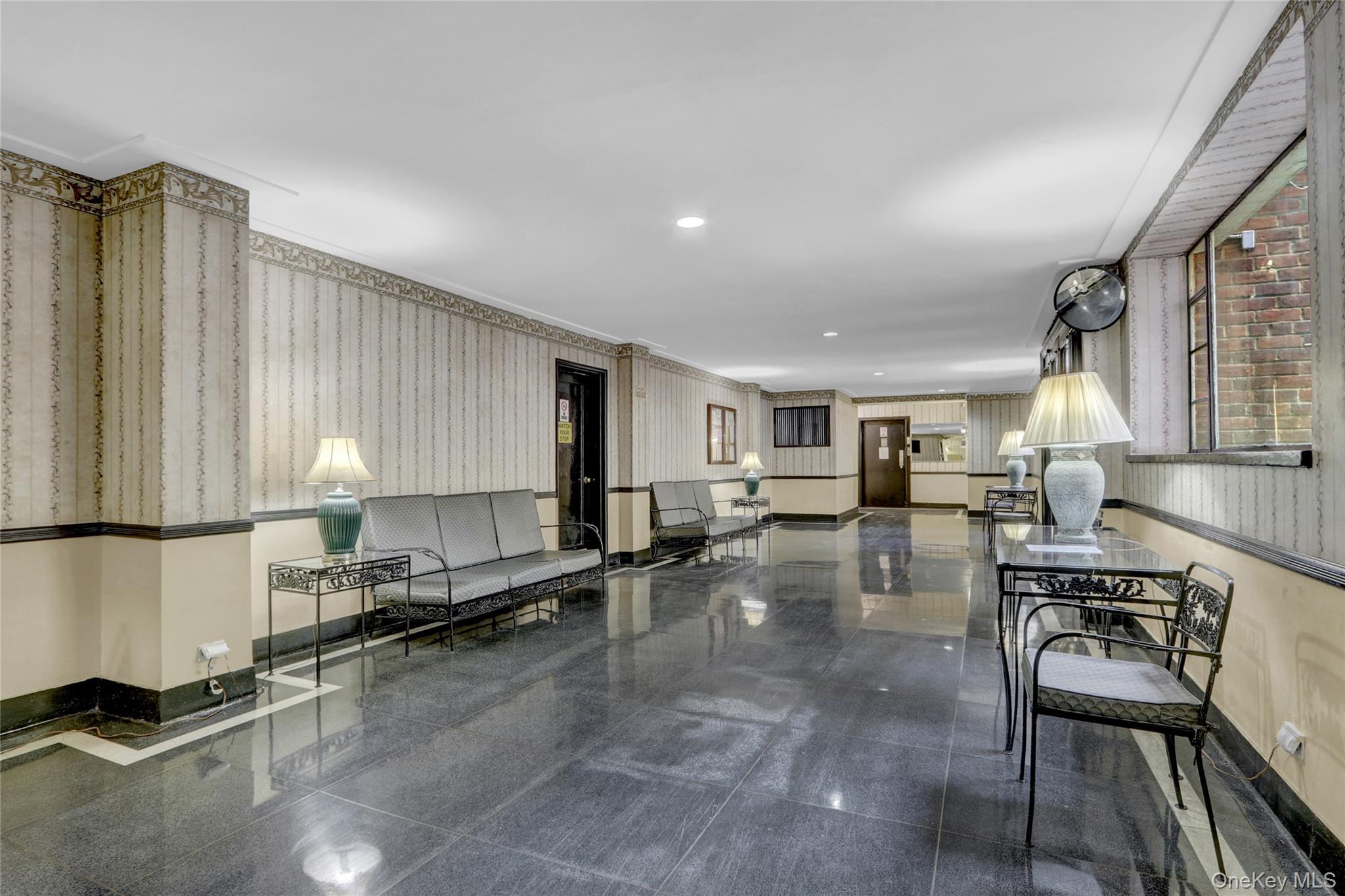 325 East 201st Street, Unit 3J Bronx, NY 10458 - Photo 4 of 33 a open kitchen with stainless steel appliances granite countertop a stove a sink a dining table and chairs with wooden floor