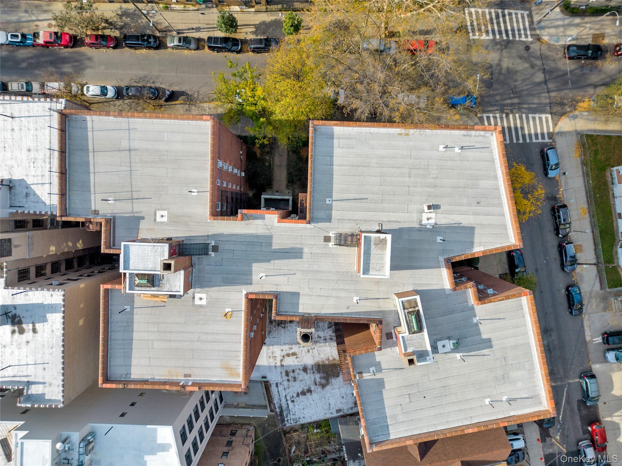325 East 201st Street, Unit 3J Bronx, NY 10458 - Photo 7 of 33 an aerial view of residential houses with outdoor space