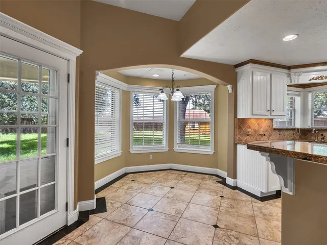 a view of a kitchen with a sink and a window