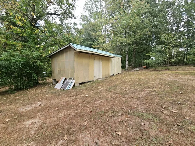 a kitchen with kitchen island a stove a sink and a refrigerator