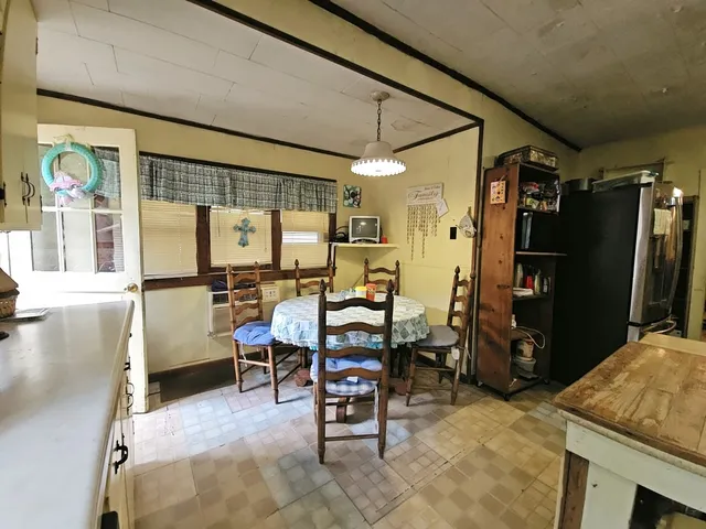 a kitchen with stainless steel appliances a refrigerator and a stove