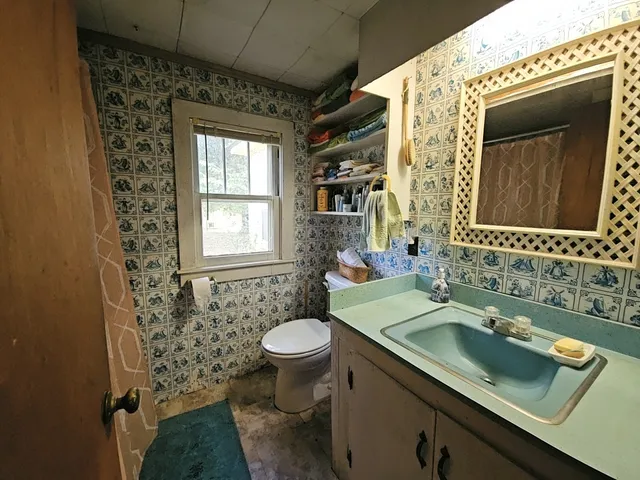 a view of a livingroom with furniture and a livingroom with furniture