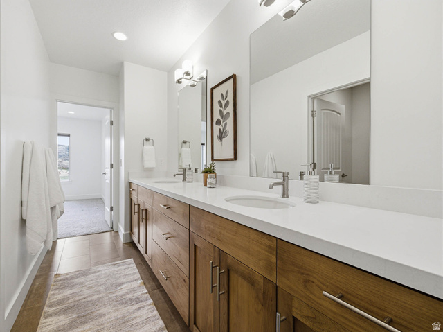 402 Shadow Hill Road Wanship, UT 84017 - Photo 56 of 90 Bathroom featuring double vanity, light tile patterned floors, and recessed lighting