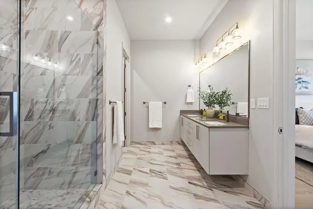 a bathroom with a double vanity sink and mirror
