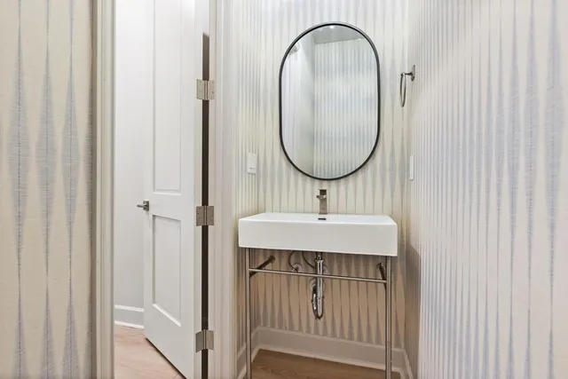 a bathroom with a sink and a mirror