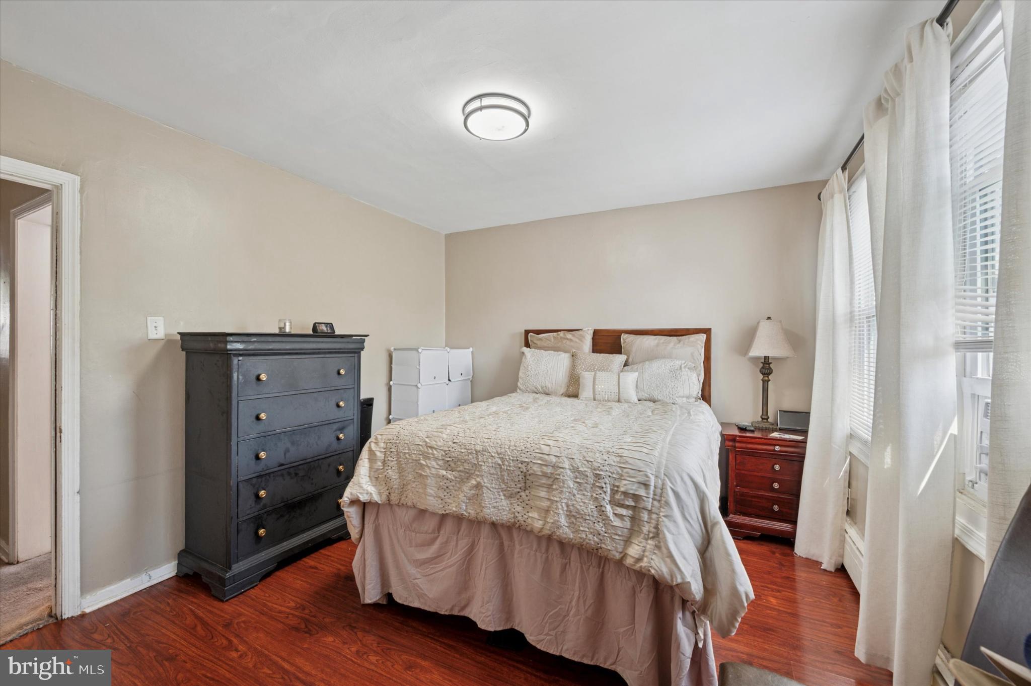 1052 Edgemore Road Philadelphia, PA 19151 - Photo 14 of 24 Cozy bedroom with warm wooden accents.