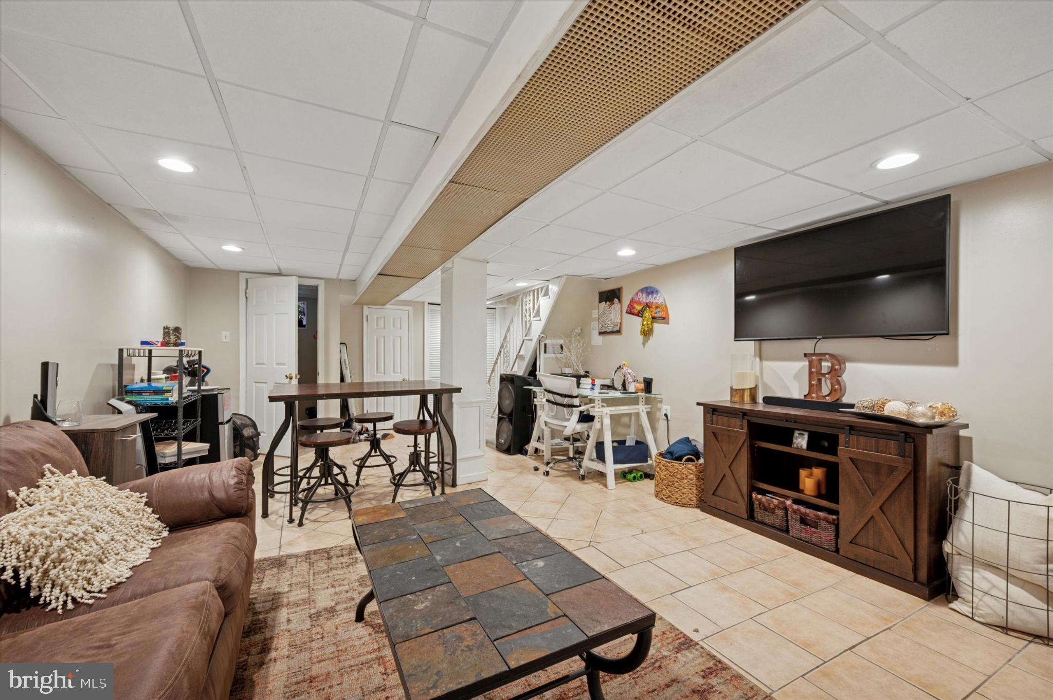 1052 Edgemore Road Philadelphia, PA 19151 - Photo 21 of 24 Cozy basement retreat with modern amenities.