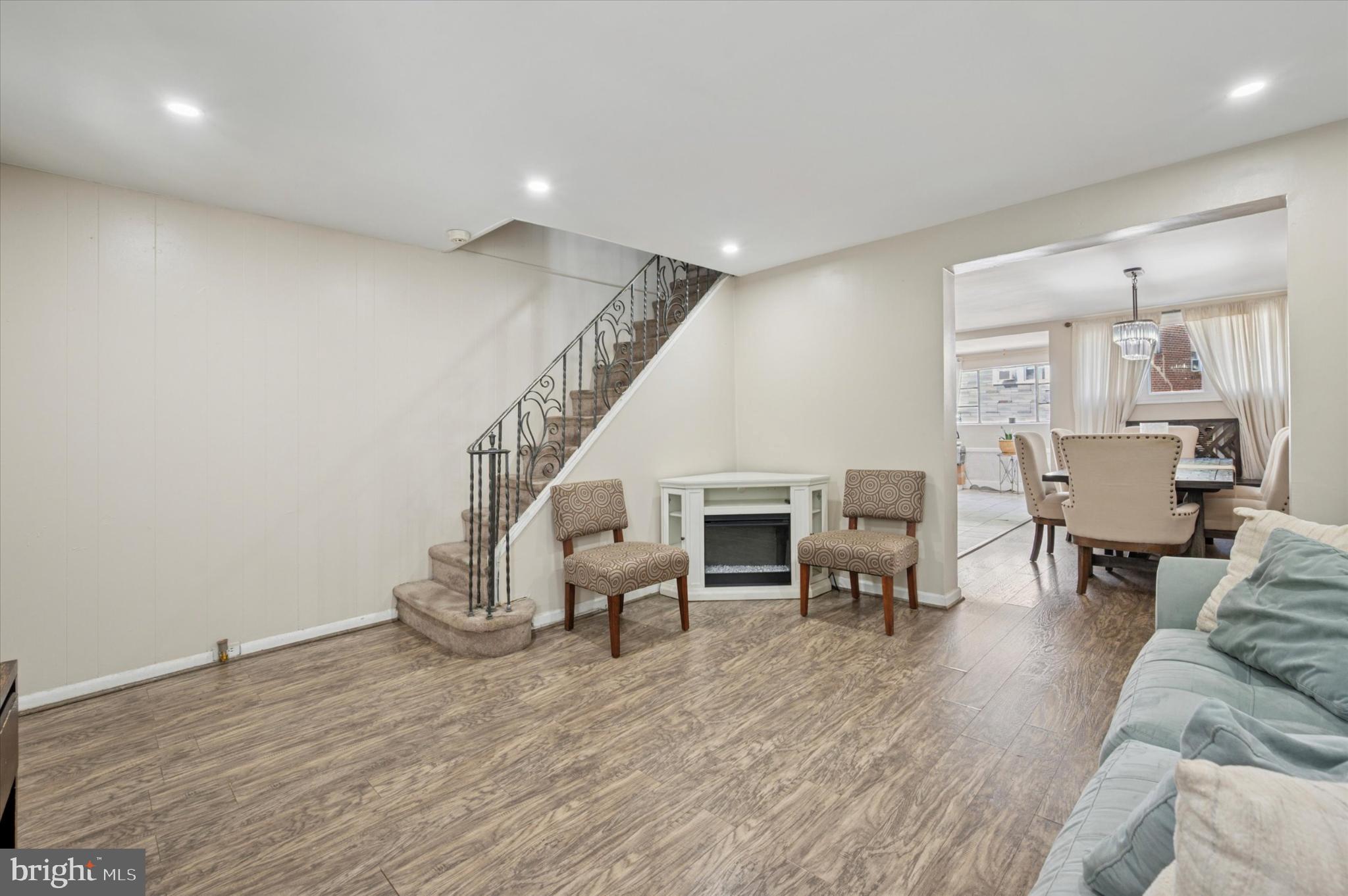 1052 Edgemore Road Philadelphia, PA 19151 - Photo 5 of 24 Spacious living area with inviting staircase.