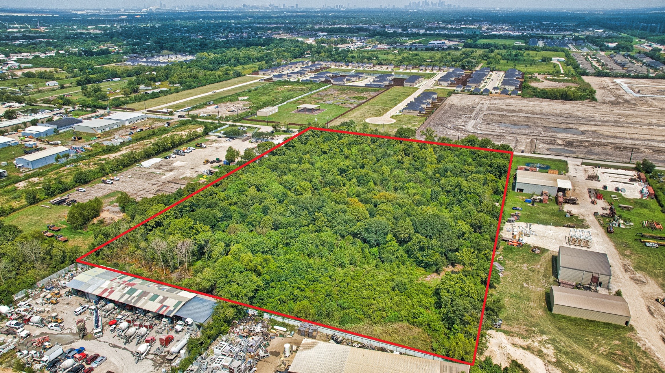 0 Fuqua Street Houston, TX 77048 - Photo 7 of 12 an aerial view of residential houses with outdoor space and trees