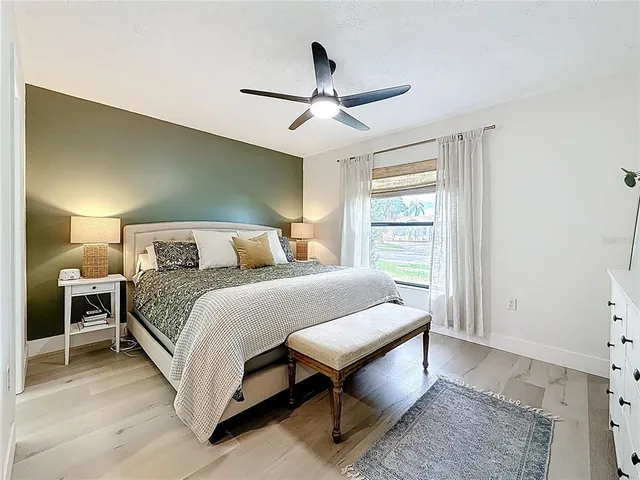 a bedroom with a bed and window