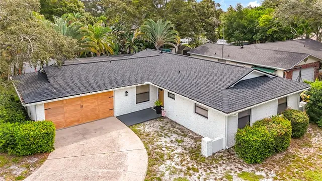 a aerial view of a house with a yard