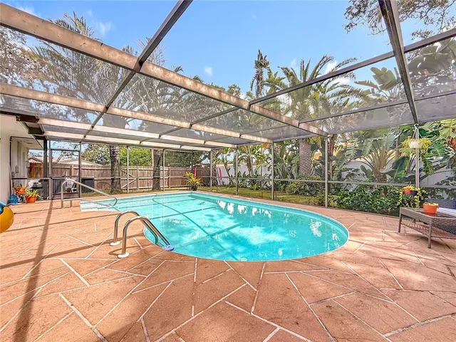 a view of a swimming pool with a patio