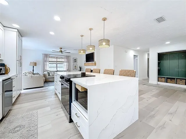 a view of living room with furniture and a flat screen tv