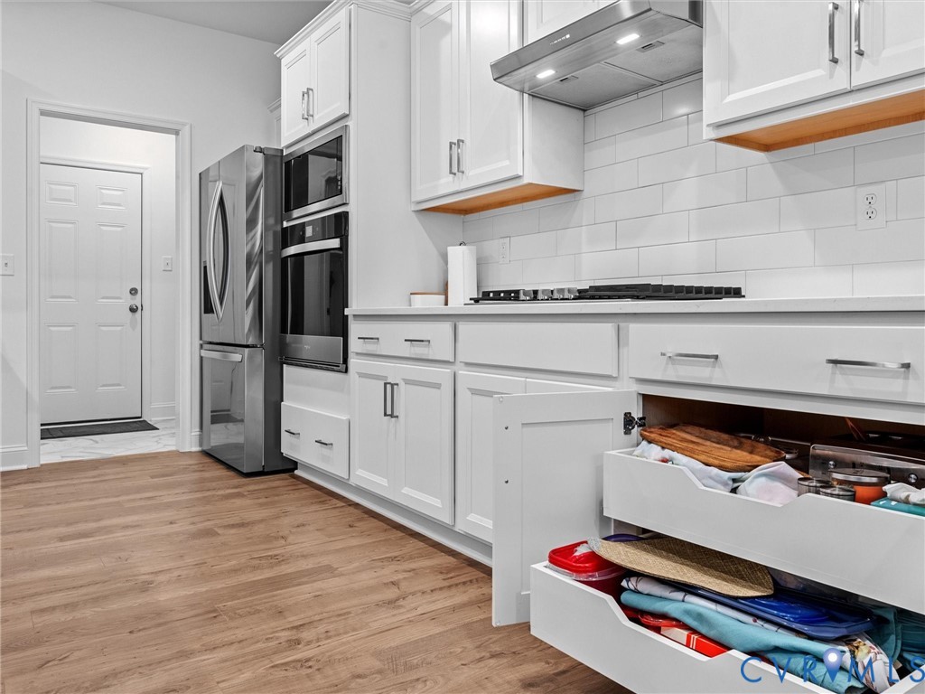 13736 Randolph Pond Lane Midlothian, VA 23114 - Photo 11 of 37 a kitchen with stainless steel appliances granite countertop a refrigerator and a stove