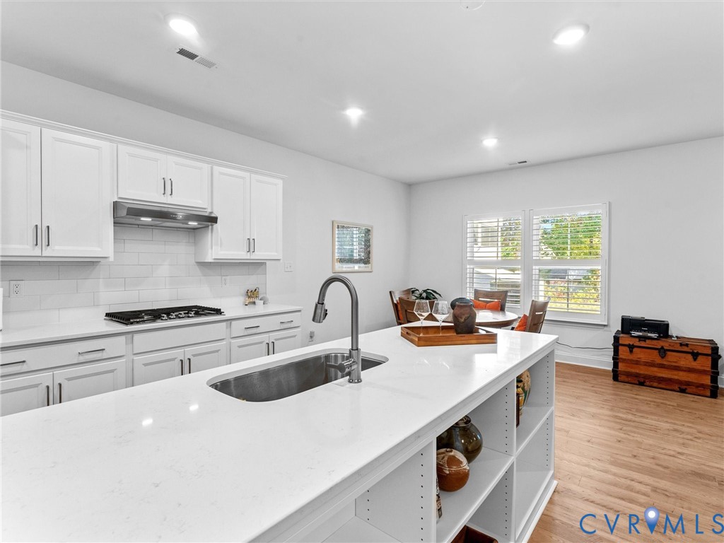 13736 Randolph Pond Lane Midlothian, VA 23114 - Photo 12 of 37 a kitchen with stainless steel appliances granite countertop a sink stove and cabinets