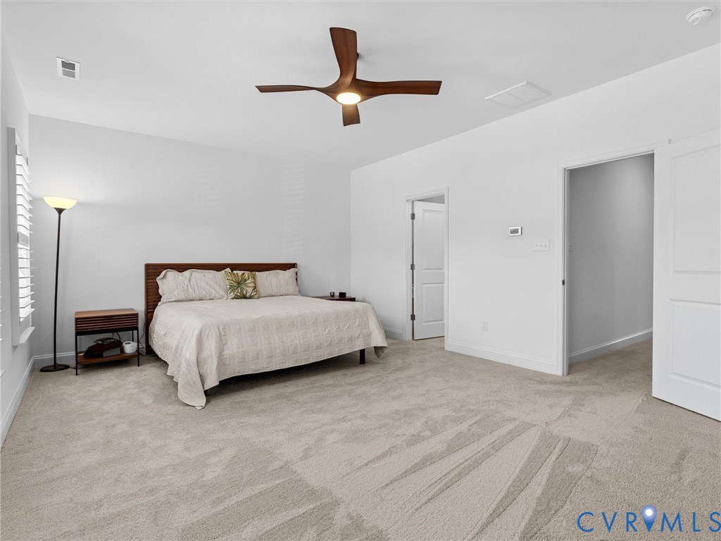 13736 Randolph Pond Lane Midlothian, VA 23114 - Photo 19 of 37 a bedroom with a bed and a ceiling fan