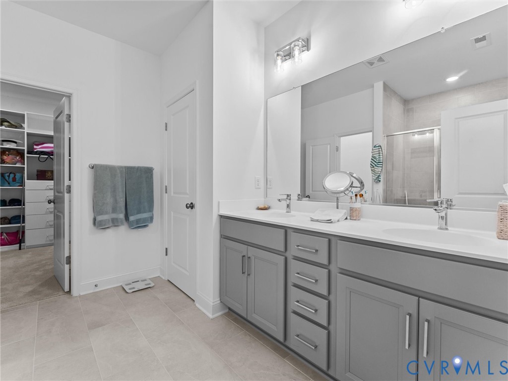 13736 Randolph Pond Lane Midlothian, VA 23114 - Photo 22 of 37 a bathroom with a double vanity sink and mirror