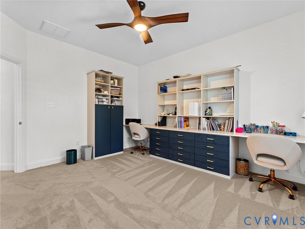 13736 Randolph Pond Lane Midlothian, VA 23114 - Photo 30 of 37 a bedroom with a bed and a chandelier