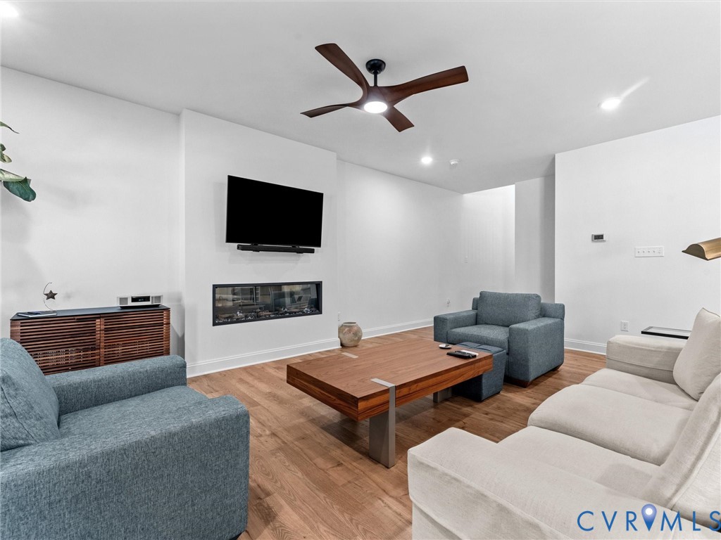 13736 Randolph Pond Lane Midlothian, VA 23114 - Photo 6 of 37 a living room with furniture and a flat screen tv