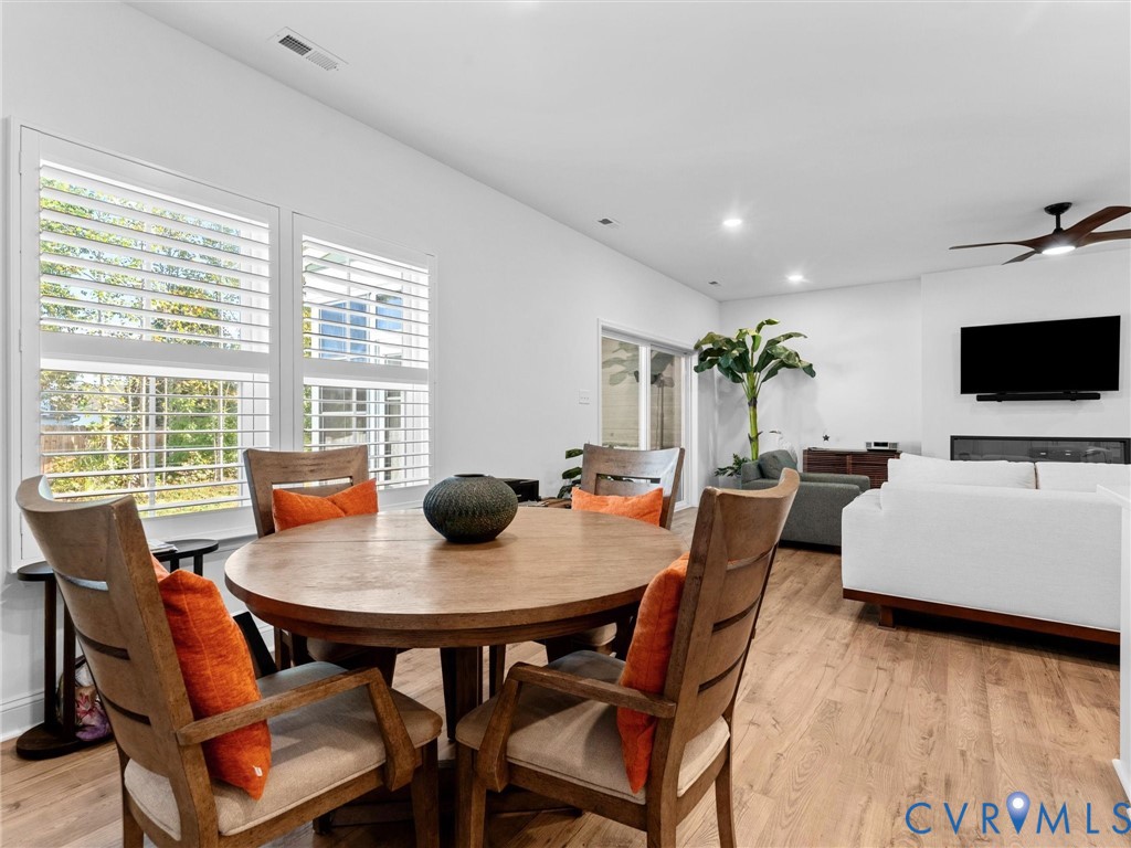 13736 Randolph Pond Lane Midlothian, VA 23114 - Photo 7 of 37 a view of a dining room with furniture and wooden floor