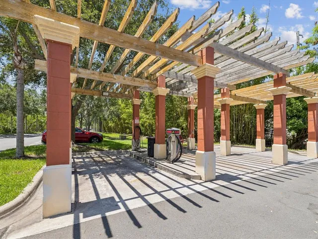 a view of a patio with a table and chairs