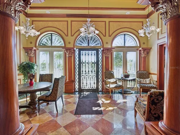 a view of a livingroom with furniture window and wooden floor