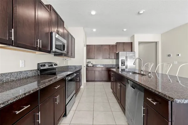 a view of a dining room and kitchen with furniture and window