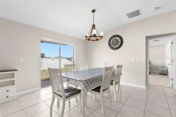 a view of a kitchen with cabinets and stainless steel appliances