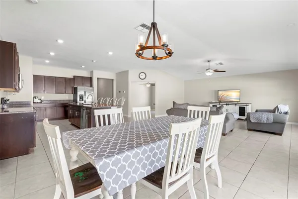 a view of room with a window and a ceiling fan