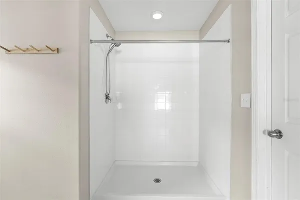 a bedroom with a bed and storage