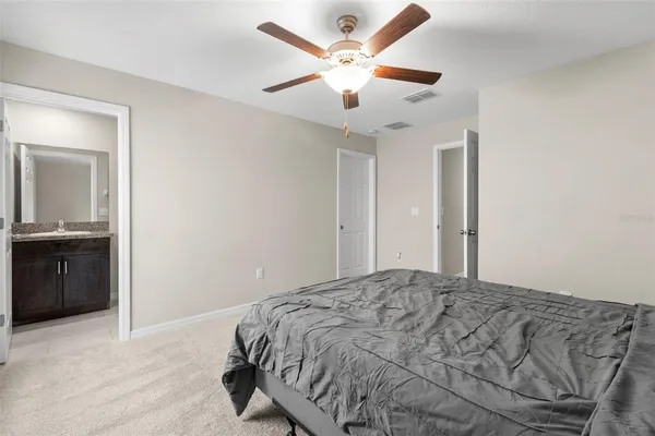a view of walk in closet with clothes