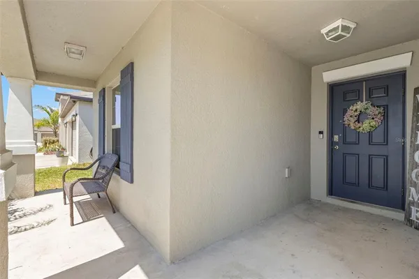 a spacious bathroom with a granite countertop sink a mirror and a shower