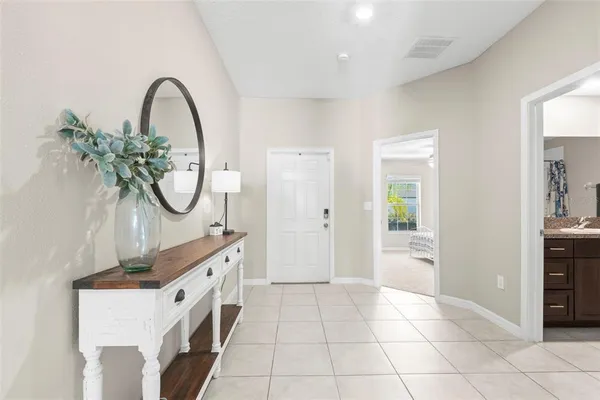 a living room with furniture and a rug