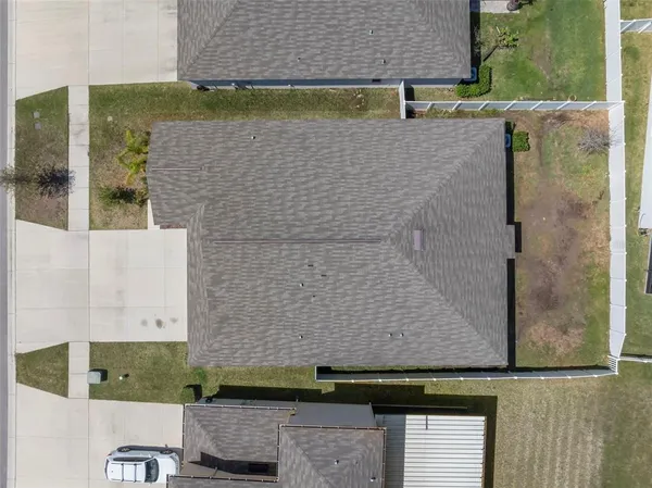 an aerial view of a house with swimming pool
