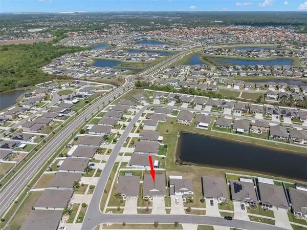 an aerial view of a house with a garden