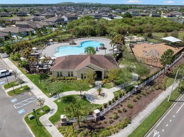 a view of a swimming pool with outdoor seating
