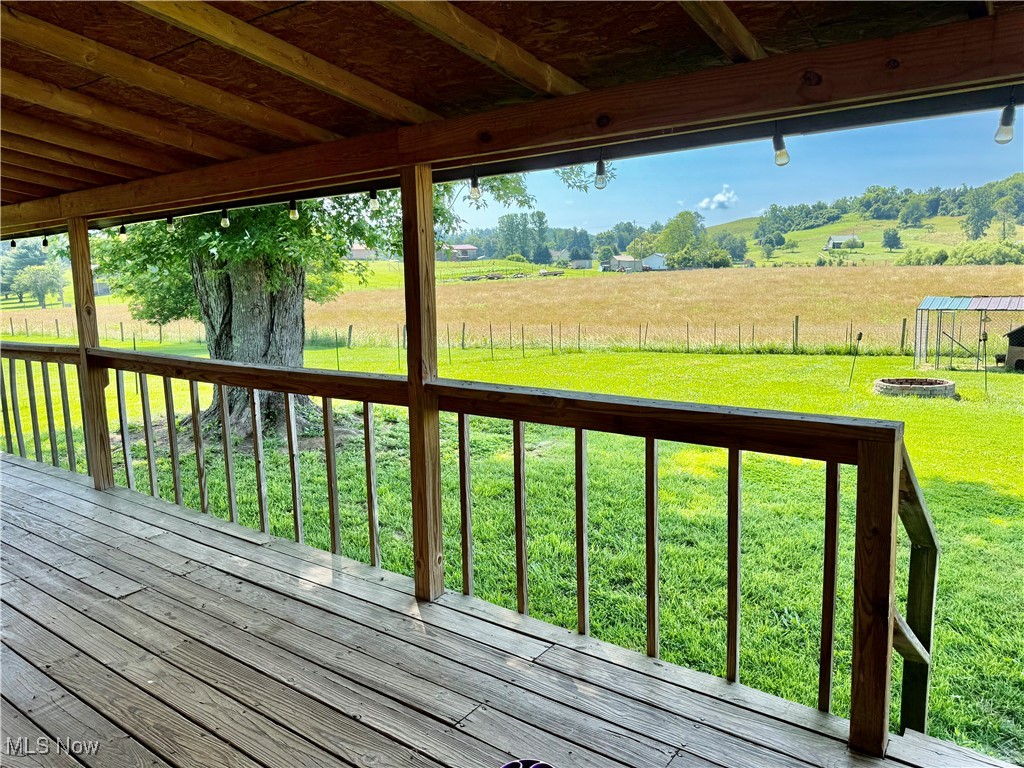 2917 Wells Lock Road Elizabeth, WV 26143 - Photo 23 of 26 covered back Deck featuring a back yard and a view of countryside