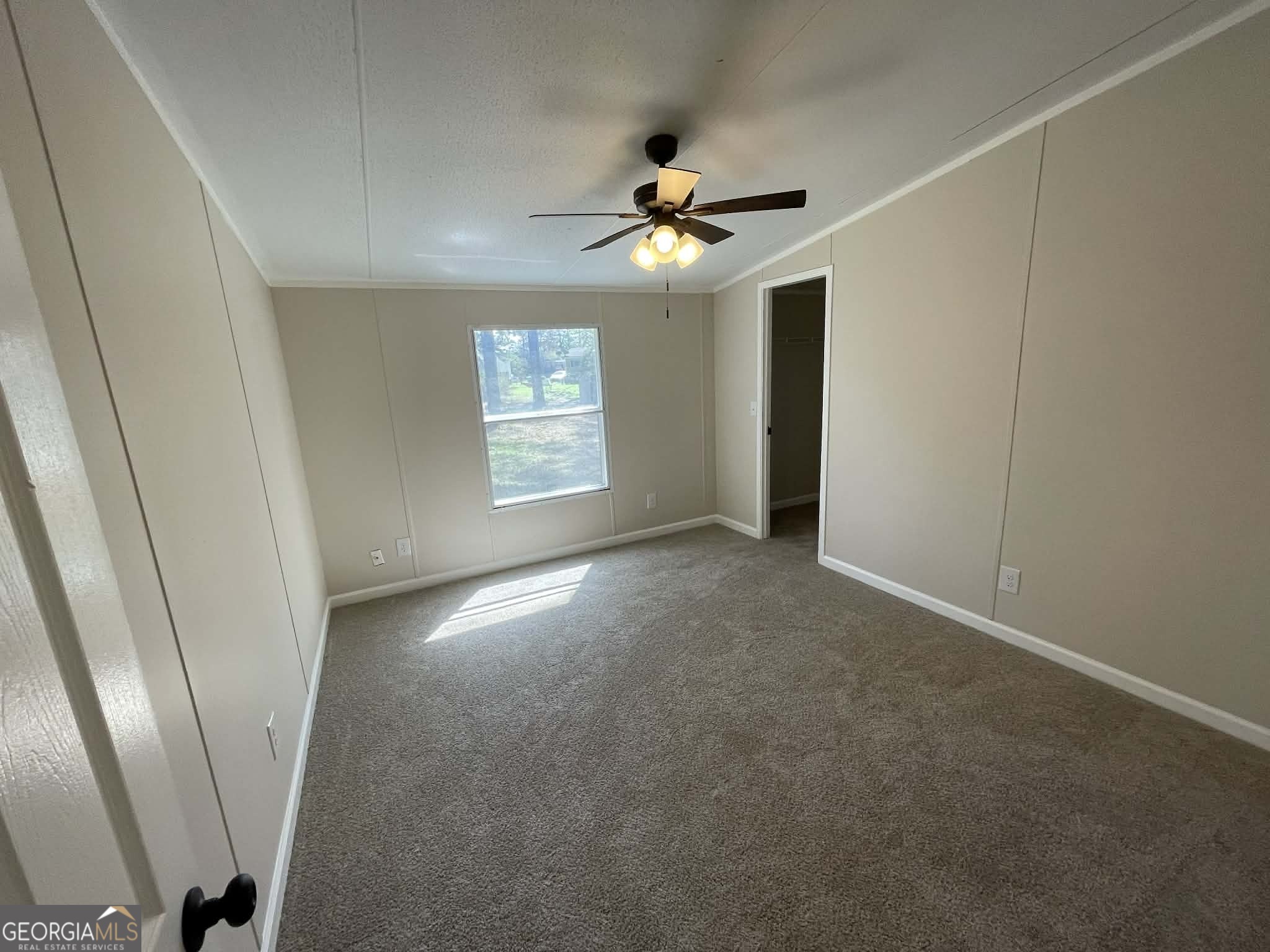 105 Senimor Court Perry, GA 31069 - Photo 17 of 27 an empty room with windows and fan