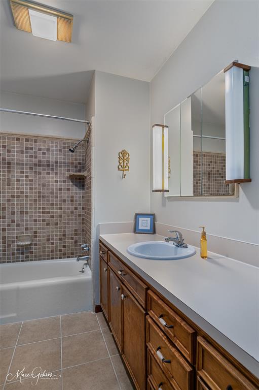 400 Southfield Road Shreveport, LA 71106 - Photo 13 of 30 a bathroom with a sink a bathtub a mirror and shower