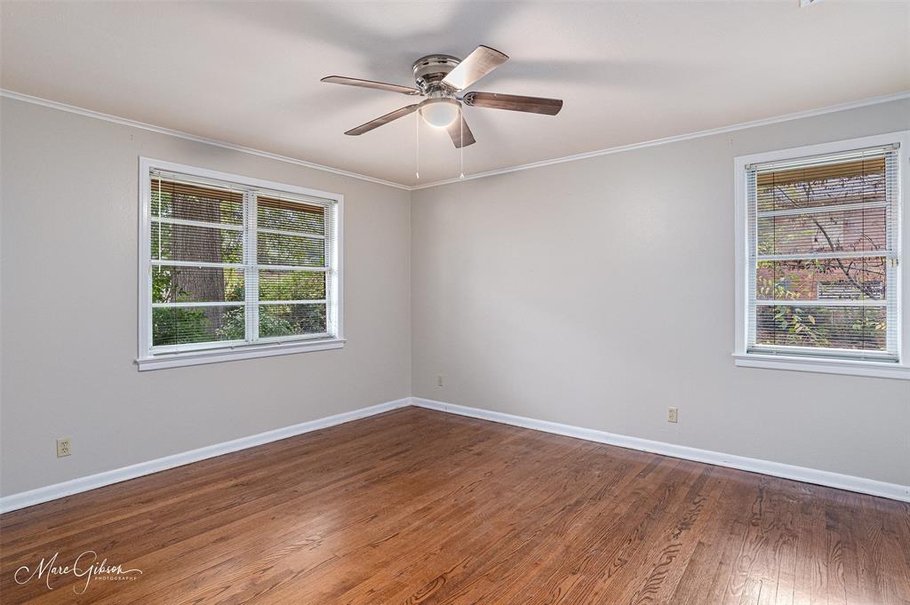 400 Southfield Road Shreveport, LA 71106 - Photo 14 of 30 a view of an empty room with wooden floor and a window