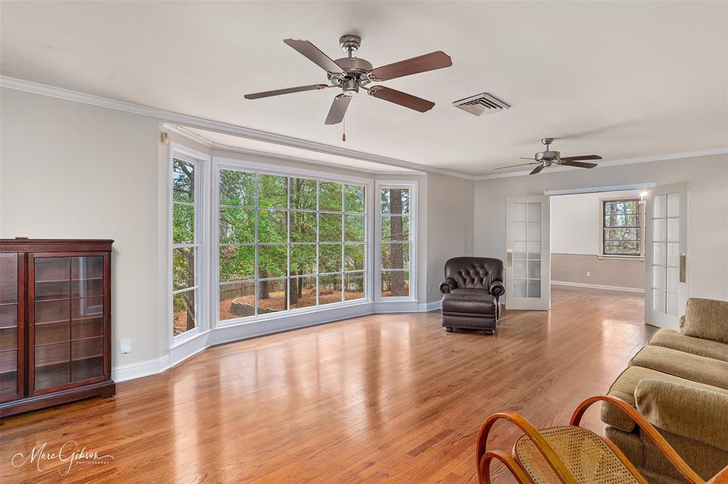 400 Southfield Road Shreveport, LA 71106 - Photo 5 of 30 a living room with furniture and a large window with wooden floor