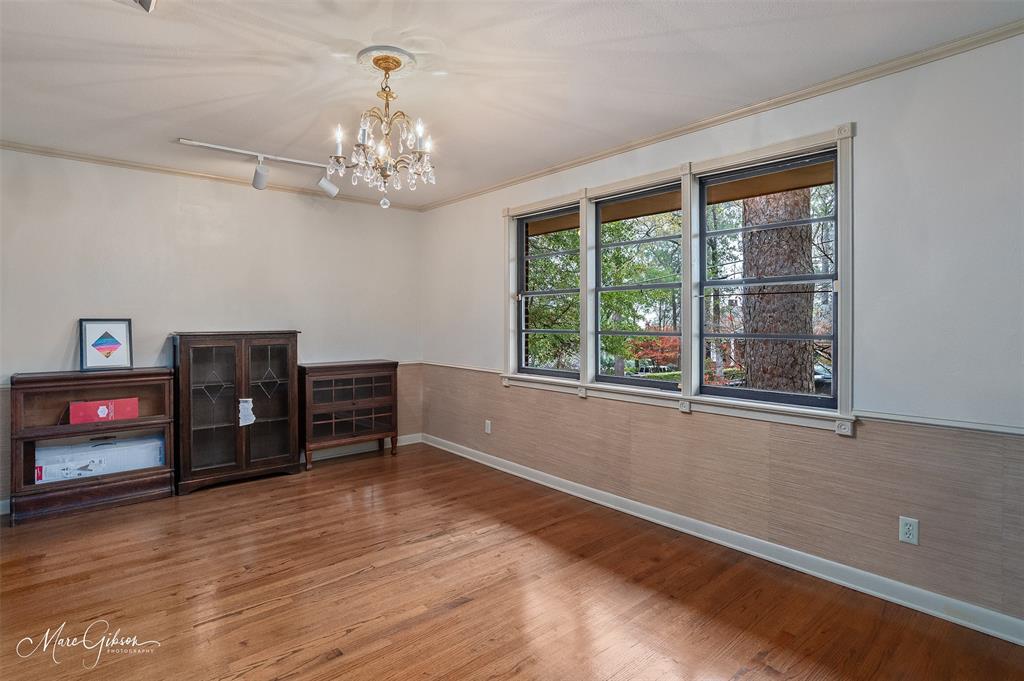 400 Southfield Road Shreveport, LA 71106 - Photo 8 of 30 a view of a livingroom with furniture chandelier and a window