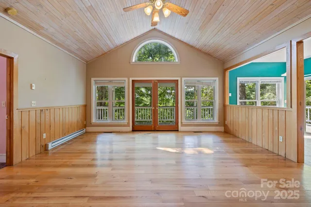 a view of an entryway with wooden floor