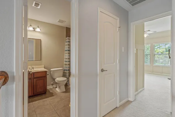 a bathroom with a sink toilet a mirror and shower
