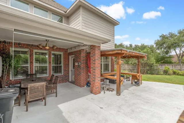 a view of a house with swimming pool and a yard