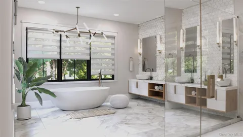 a bathroom with a tub a potted plant and a shower